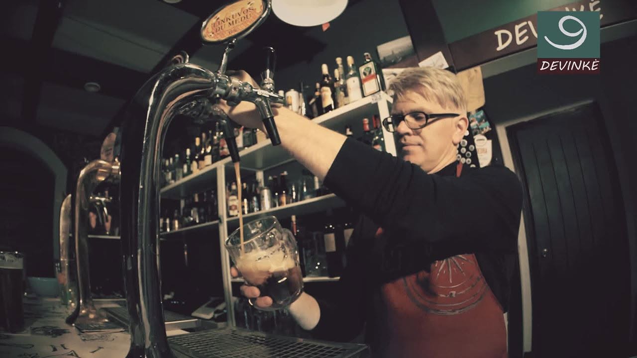 Bartender pouring a drink at Devinkė Bar